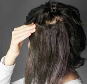 Comb hair extension on wig