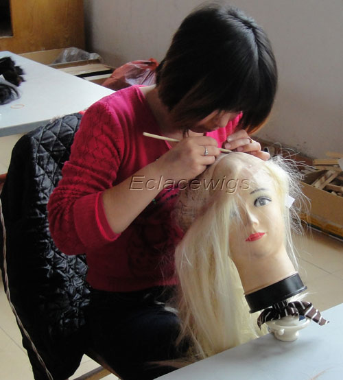 a worker tie hair on wig lace base